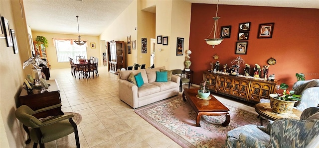 living room with a textured ceiling, light tile patterned flooring, and lofted ceiling