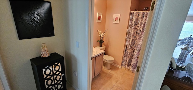 bathroom featuring tile patterned floors, vanity, and toilet