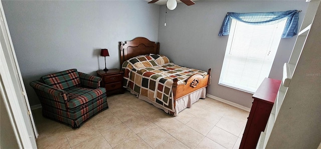 bedroom featuring ceiling fan and light tile patterned floors