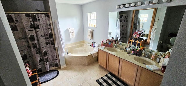 bathroom with plus walk in shower, vanity, and tile patterned flooring