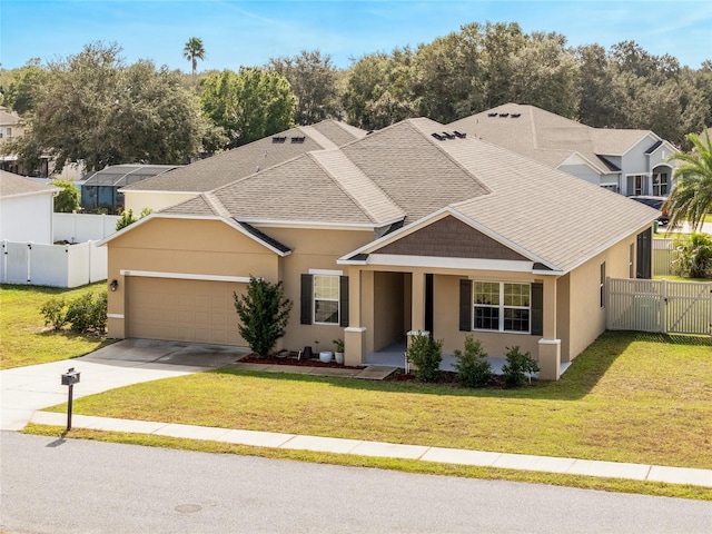 view of front of home with a garage and a front lawn