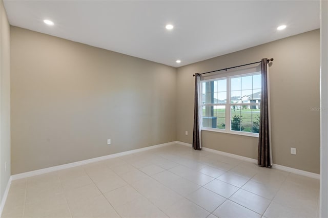 empty room with light tile patterned floors