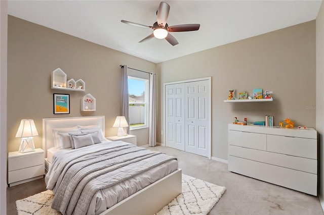 bedroom with ceiling fan and a closet