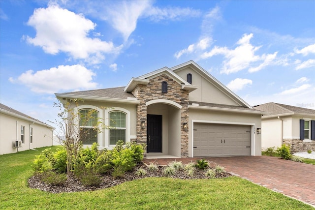 view of front facade featuring a garage and a front lawn