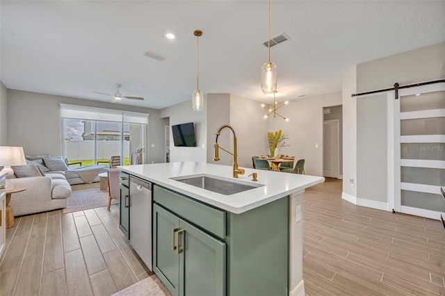 1554 Outback Rd W, Saint Cloud, FL 34771 - kitchen with green cabinets, open floor plan, a barn door, and light wood-style flooring