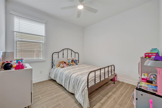 1554 Outback Rd W, Saint Cloud, FL 34771 - bedroom with wood finish floors and a ceiling fan