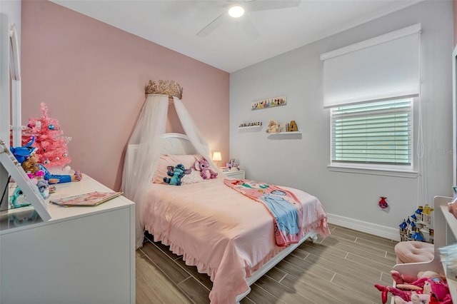 1554 Outback Rd W, Saint Cloud, FL 34771 - bedroom featuring wood tiled floors and a ceiling fan