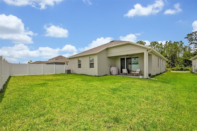 1554 Outback Rd W, Saint Cloud, FL 34771 - rear view of property featuring a ceiling fan, a patio area, stucco siding, and a fenced backyard