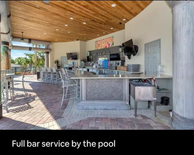 view of patio / terrace with exterior bar