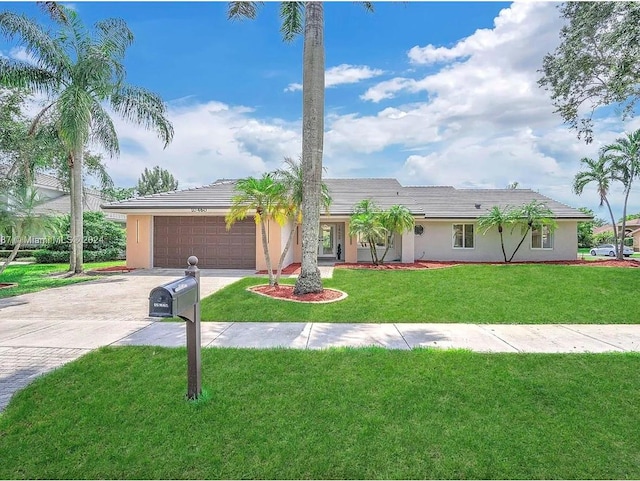 single story home with a front lawn and a garage