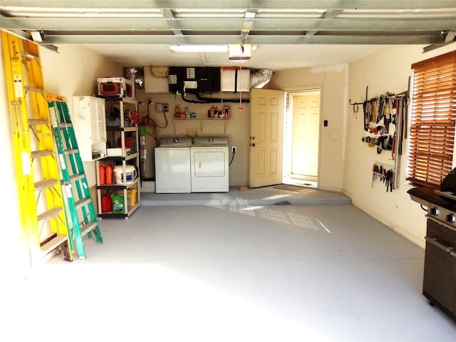 garage featuring washing machine and dryer