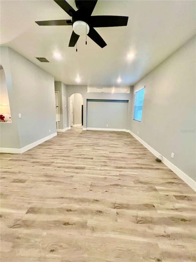 spare room with ceiling fan and light hardwood / wood-style flooring