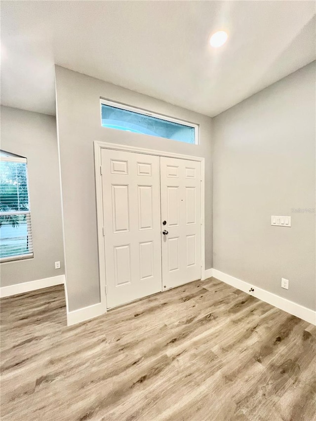 foyer entrance featuring hardwood / wood-style flooring