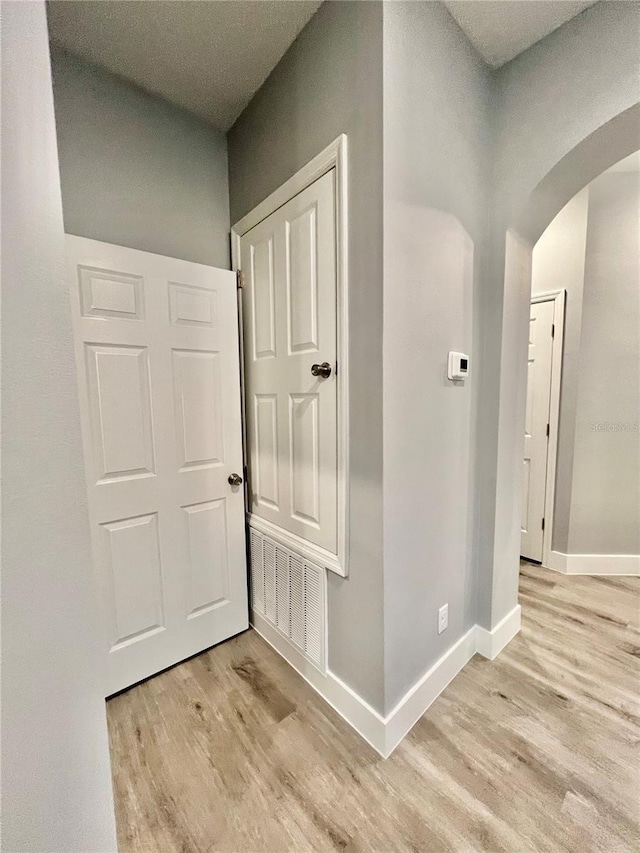 corridor featuring light hardwood / wood-style flooring