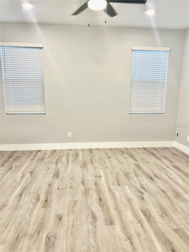 spare room with light hardwood / wood-style flooring