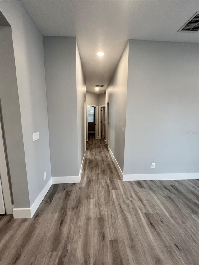 corridor featuring hardwood / wood-style floors