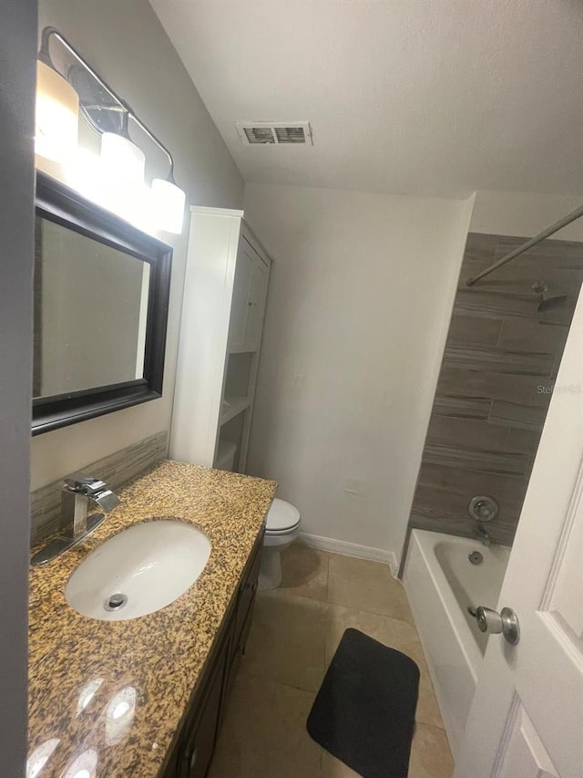 full bathroom featuring toilet, vanity, tile patterned floors, and shower / bathtub combination