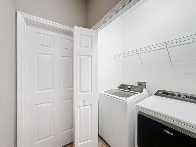 washroom with washer and dryer and laundry area