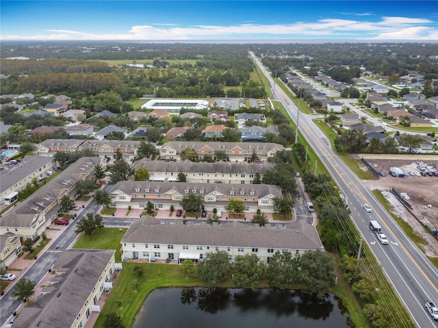 birds eye view of property featuring a water view and a residential view