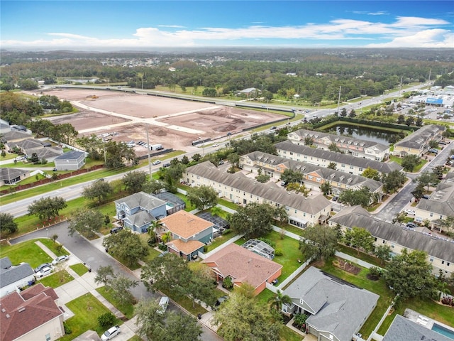 aerial view with a residential view and a water view