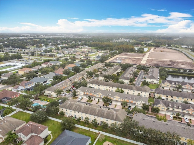 birds eye view of property with a water view and a residential view