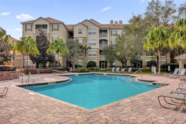 view of swimming pool with a patio area