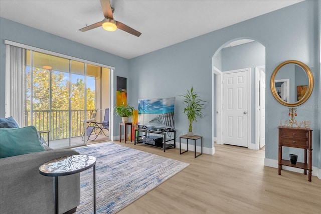 sitting room with ceiling fan and light hardwood / wood-style floors