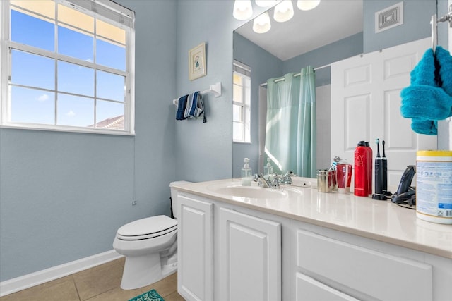 bathroom featuring vanity, toilet, curtained shower, and tile patterned flooring