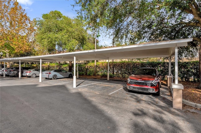 view of parking / parking lot with a carport