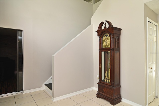 stairs with tile patterned floors