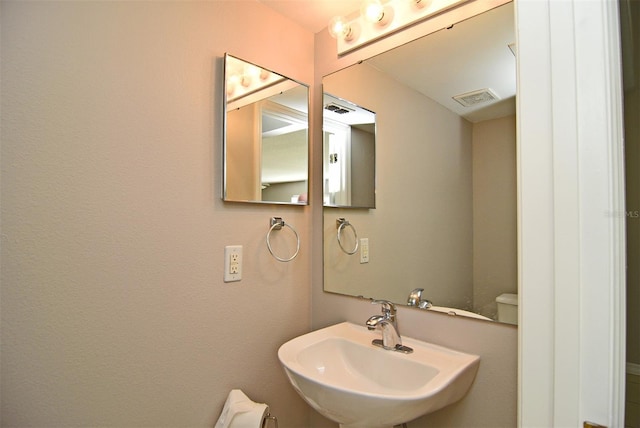 bathroom with sink and toilet