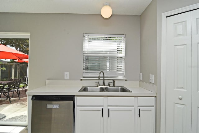 kitchen featuring white cabinets, sink, and dishwasher