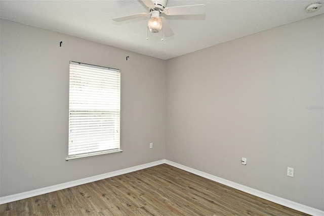 unfurnished room with wood-type flooring, ceiling fan, and a textured ceiling