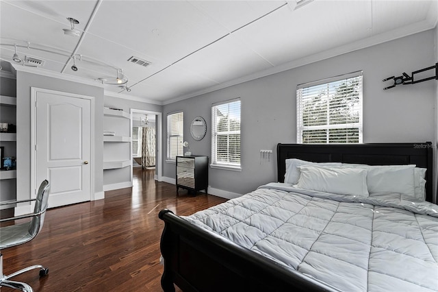 bedroom featuring dark hardwood / wood-style flooring and crown molding