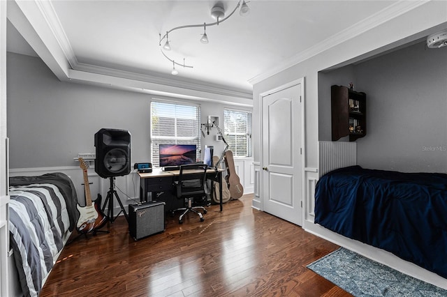 bedroom with dark hardwood / wood-style flooring and crown molding