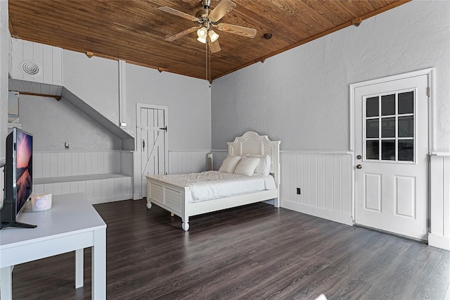 unfurnished room with dark hardwood / wood-style flooring, wooden ceiling, and ceiling fan