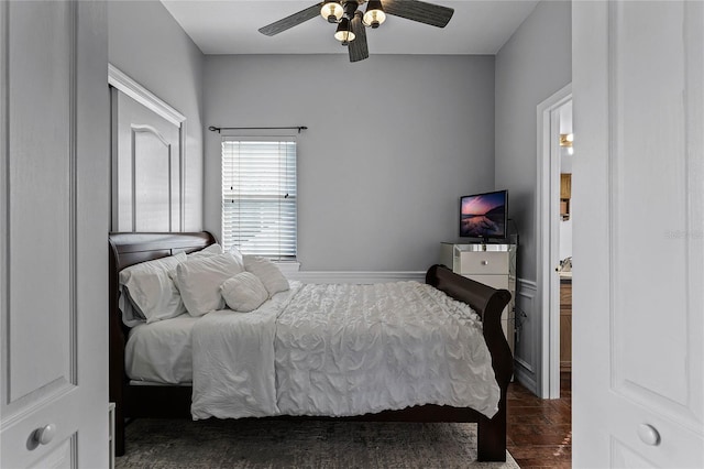 bedroom featuring dark hardwood / wood-style flooring and ceiling fan