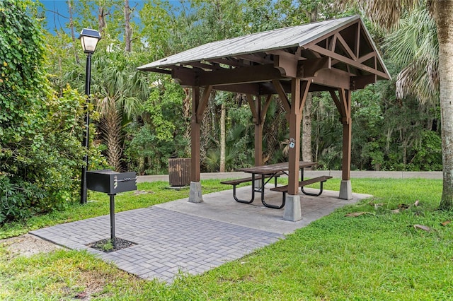 view of community with a gazebo, a yard, and a patio area