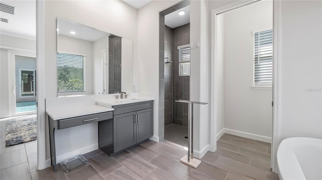 bathroom featuring plus walk in shower and vanity