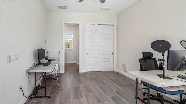 home office with ceiling fan and wood-type flooring