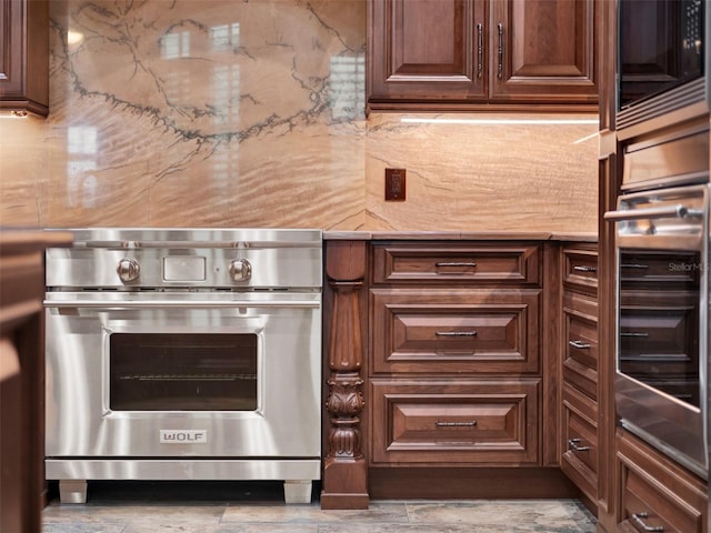 kitchen with backsplash, appliances with stainless steel finishes, and light countertops