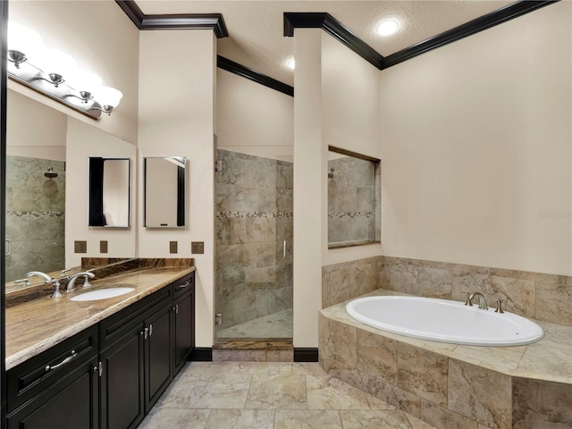 bathroom with vanity, a garden tub, crown molding, and a tile shower