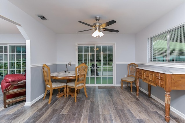 dining room featuring dark hardwood / wood-style floors and ceiling fan