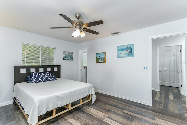 bedroom with ceiling fan and dark hardwood / wood-style flooring