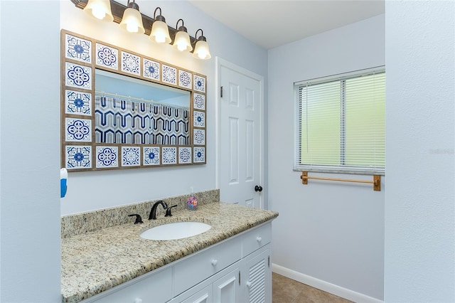 bathroom with tile patterned floors and vanity