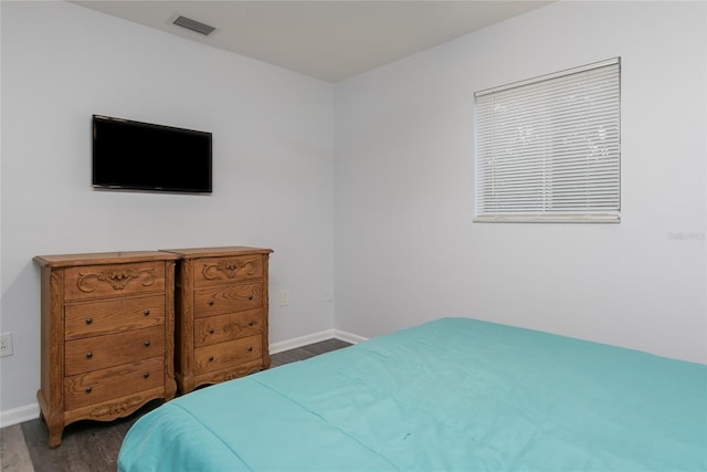 bedroom featuring dark wood-type flooring