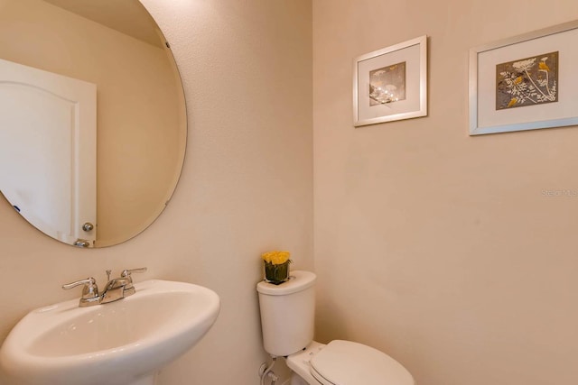 bathroom with toilet and sink