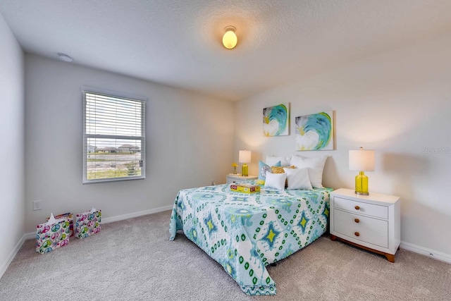 carpeted bedroom featuring a textured ceiling