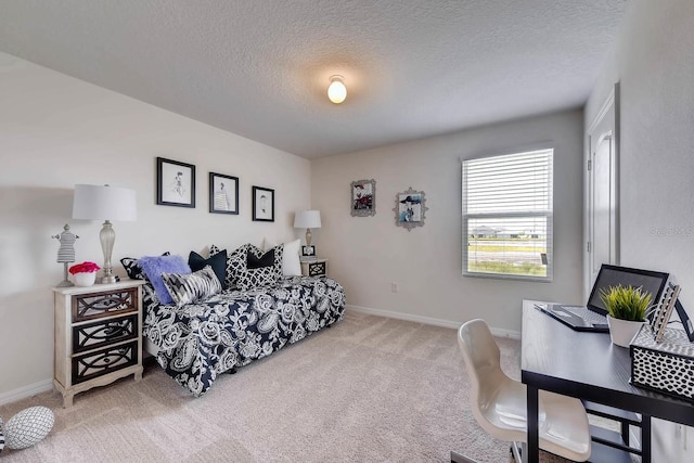 carpeted bedroom with a textured ceiling