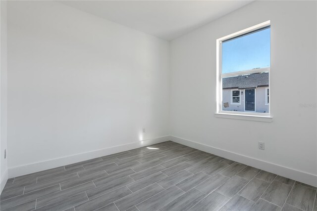 empty room featuring hardwood / wood-style flooring